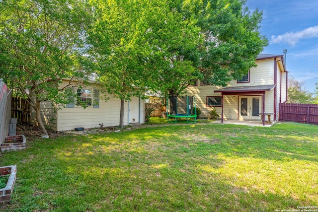 1130 Stone Gdn, New Braunfels, TX 78130 - rear view of property featuring a trampoline, french doors, a patio area, and an outdoor structure