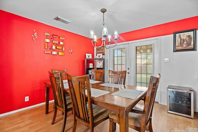 1130 Stone Gdn, New Braunfels, TX 78130 - dining room with light wood-type flooring, a chandelier, heating unit, and baseboards