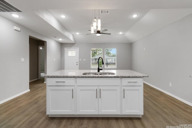 519 W Mitchell, San Antonio, TX 78204 - kitchen with a sink, ceiling fan, white cabinetry, baseboards, and recessed lighting