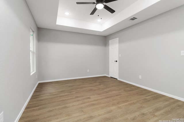 519 W Mitchell, San Antonio, TX 78204 - empty room with ceiling fan, baseboards, a raised ceiling, light wood-type flooring, and recessed lighting