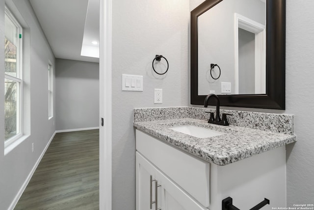 519 W Mitchell, San Antonio, TX 78204 - bathroom with wood finished floors, vanity, baseboards, and recessed lighting