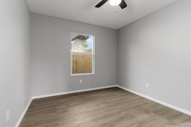 519 W Mitchell, San Antonio, TX 78204 - spare room with ceiling fan, wood finished floors, and baseboards