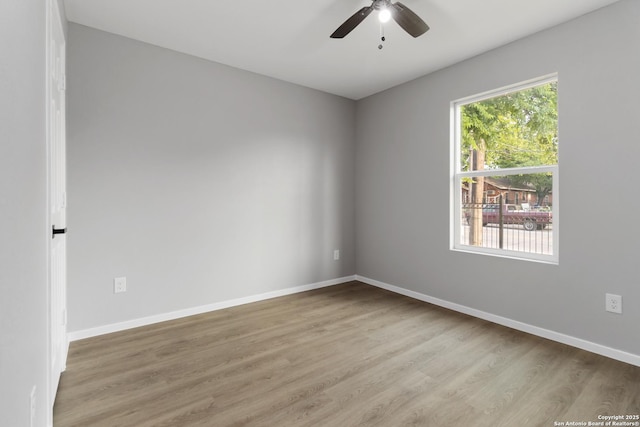 519 W Mitchell, San Antonio, TX 78204 - spare room featuring wood finished floors, ceiling fan, and baseboards