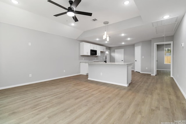 519 W Mitchell, San Antonio, TX 78204 - unfurnished living room with attic access, ceiling fan, light wood-style flooring, baseboards, and recessed lighting