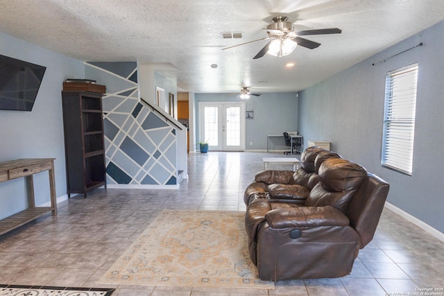 5311 Moreville Farm, San Antonio, TX 78228 - tiled living area featuring a ceiling fan, a textured ceiling, baseboards, and french doors
