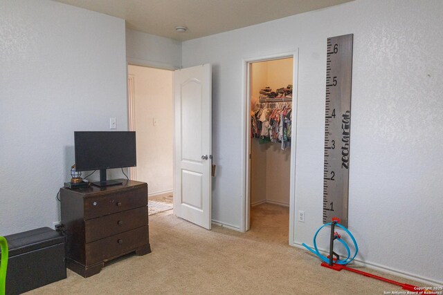 5311 Moreville Farm, San Antonio, TX 78228 - bedroom with a spacious closet, light carpet, and a closet
