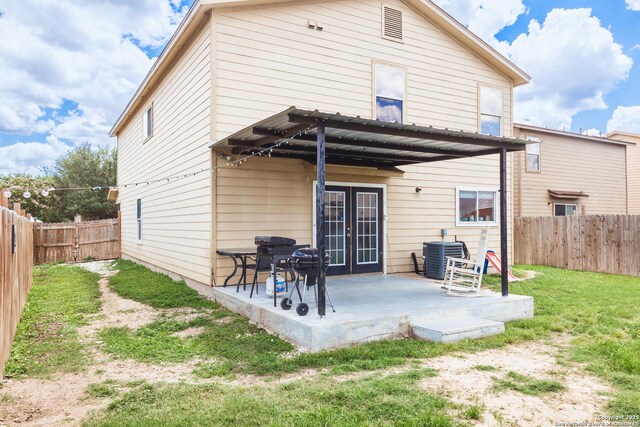 5311 Moreville Farm, San Antonio, TX 78228 - rear view of house with cooling unit, a patio, and french doors