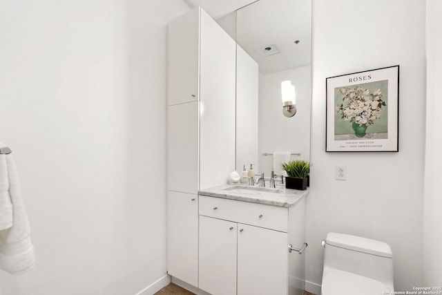 1115 S Alamo St Unit 2211, San Antonio, TX 78210 - half bath featuring baseboards, toilet, and vanity