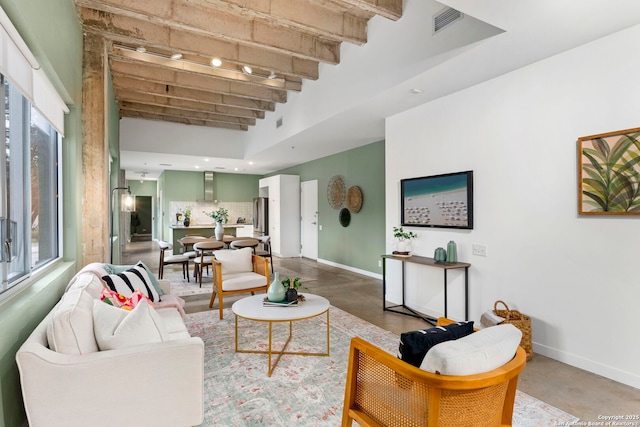 1115 S Alamo St Unit 2211, San Antonio, TX 78210 - living room featuring baseboards, a high ceiling, concrete floors, and beamed ceiling