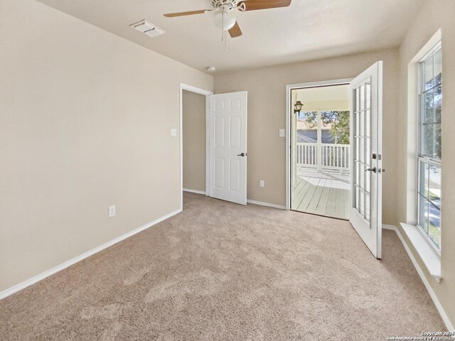 121 Lark Hl, Floresville, TX 78114 - carpeted spare room with ceiling fan and baseboards