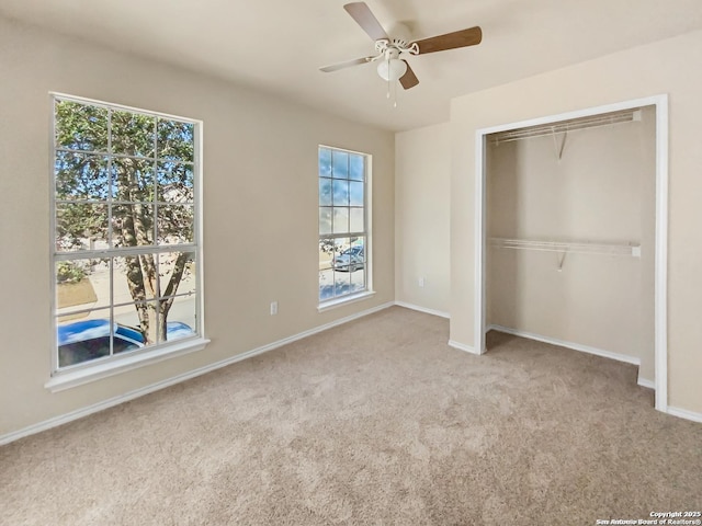 121 Lark Hl, Floresville, TX 78114 - unfurnished bedroom featuring carpet floors, baseboards, a closet, and a ceiling fan