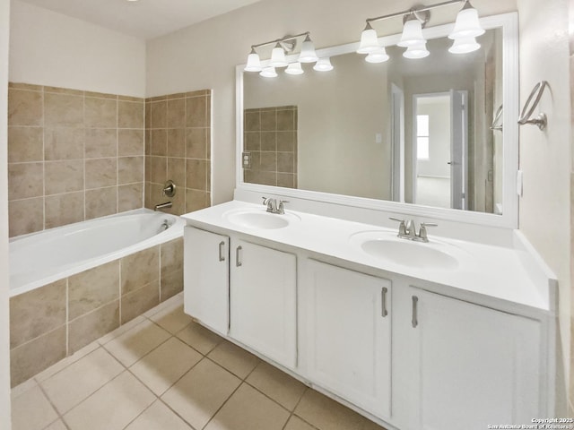 121 Lark Hl, Floresville, TX 78114 - bathroom featuring tile patterned floors, a relaxing tiled tub, and double vanity