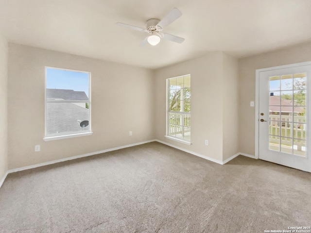 121 Lark Hl, Floresville, TX 78114 - carpeted empty room with plenty of natural light, ceiling fan, and baseboards