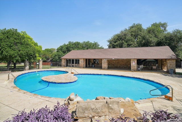 4919 Arbor Rdg, San Antonio, TX 78228 - community pool with fence, a patio area, and view of scattered trees