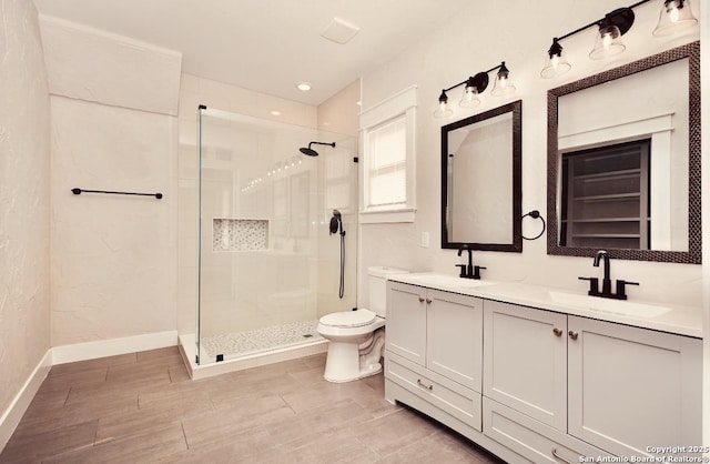 424 Club Dr, San Antonio, TX 78201 - full bath with toilet, a shower stall, double vanity, and baseboards