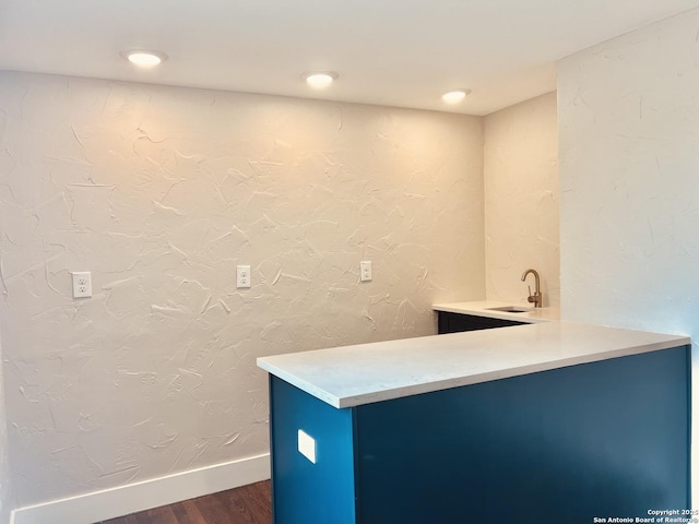 424 Club Dr, San Antonio, TX 78201 - bathroom with wood finished floors, a sink, and baseboards
