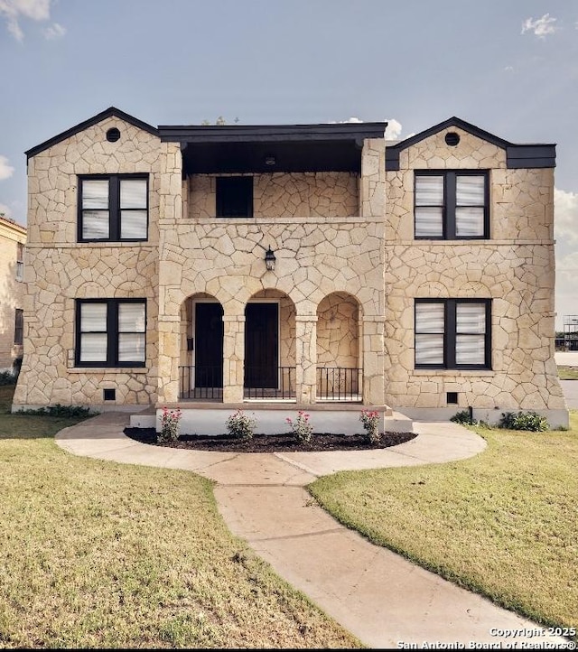 424 Club Dr, San Antonio, TX 78201 - view of front of property with a front lawn, crawl space, and stone siding