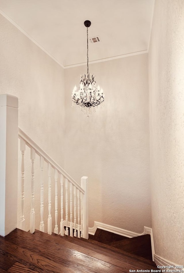 424 Club Dr, San Antonio, TX 78201 - stairway with hardwood / wood-style flooring, baseboards, ornamental molding, and a chandelier