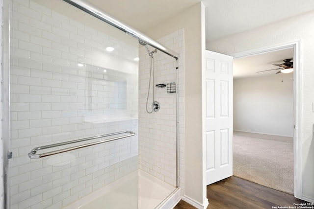 6322 Silver Pegasus, San Antonio, TX 78218 - full bath with a shower stall, a ceiling fan, and wood finished floors