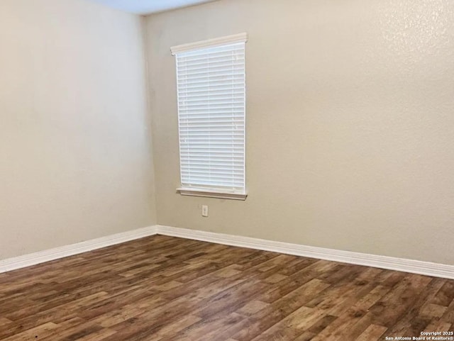 1115 Caspian, San Antonio, TX 78245 - unfurnished room featuring dark wood-type flooring and baseboards