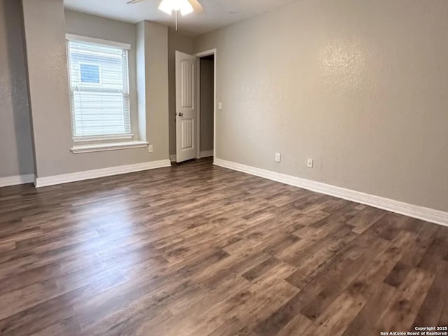 1115 Caspian, San Antonio, TX 78245 - spare room featuring a ceiling fan, dark wood-style flooring, and baseboards