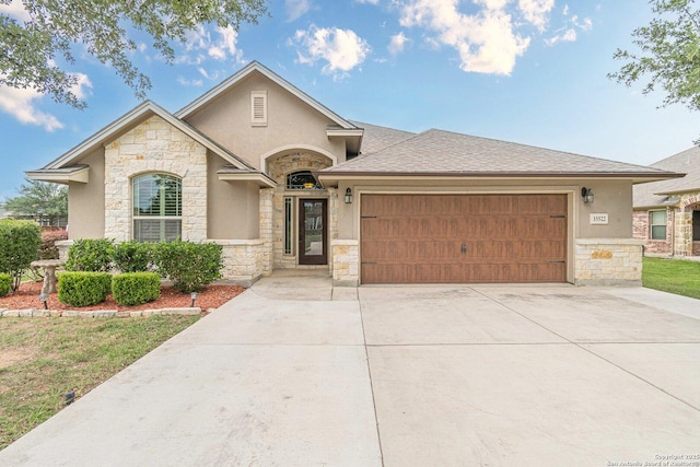 15522 Echo, Selma, TX 78154 - view of front of property featuring stone siding, stucco siding, a garage, and concrete driveway