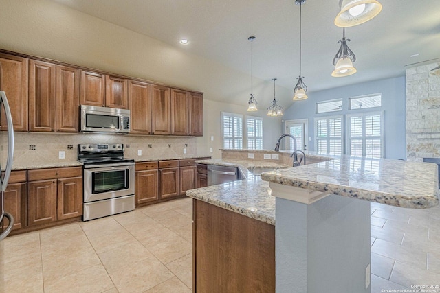 15522 Echo, Selma, TX 78154 - kitchen with stainless steel appliances, a sink, backsplash, brown cabinetry, and light stone counters