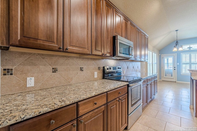 15522 Echo, Selma, TX 78154 - kitchen with appliances with stainless steel finishes, tasteful backsplash, vaulted ceiling, light stone countertops, and light tile patterned flooring
