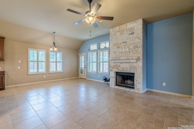 15522 Echo, Selma, TX 78154 - unfurnished living room with ceiling fan, lofted ceiling, baseboards, and a stone fireplace