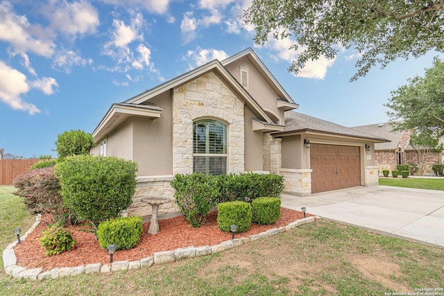 15522 Echo, Selma, TX 78154 - view of front of home featuring stone siding, a garage, driveway, stucco siding, and fence