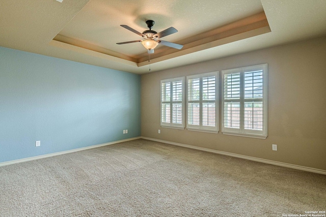 15522 Echo, Selma, TX 78154 - carpeted empty room featuring a raised ceiling, a ceiling fan, and baseboards