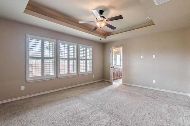 15522 Echo, Selma, TX 78154 - carpeted empty room featuring a raised ceiling, ceiling fan, and baseboards