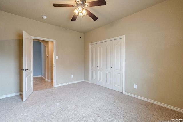 15522 Echo, Selma, TX 78154 - unfurnished bedroom featuring light carpet, a closet, ceiling fan, and baseboards