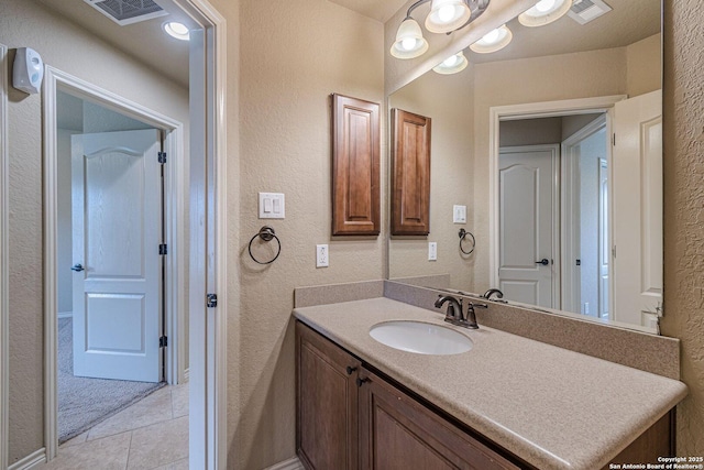 15522 Echo, Selma, TX 78154 - bathroom with a textured wall, vanity, and tile patterned floors