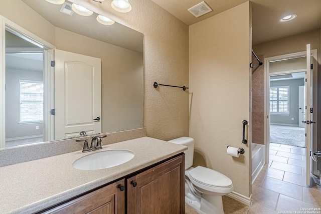 15522 Echo, Selma, TX 78154 - bathroom featuring toilet, tile patterned flooring, vanity, bathing tub / shower combination, and baseboards