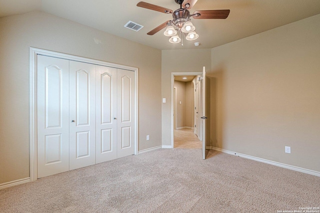 15522 Echo, Selma, TX 78154 - unfurnished bedroom with light carpet, a closet, baseboards, and a ceiling fan