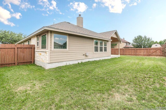 15522 Echo, Selma, TX 78154 - rear view of house featuring a chimney and roof with shingles