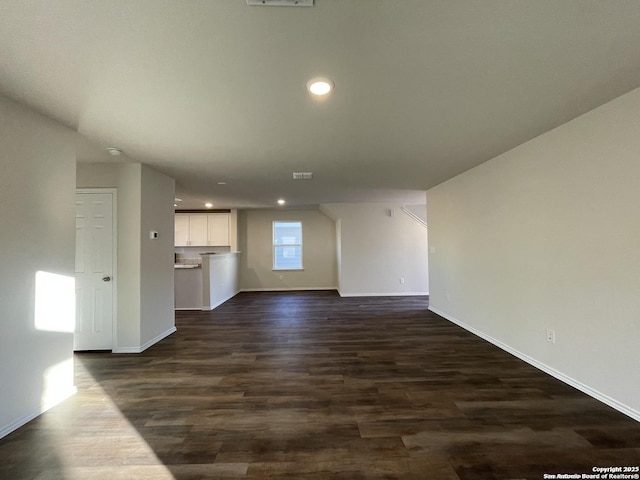 13731 Redtail Lndg, San Antonio, TX 78253 - unfurnished living room with baseboards, dark wood-style floors, and recessed lighting