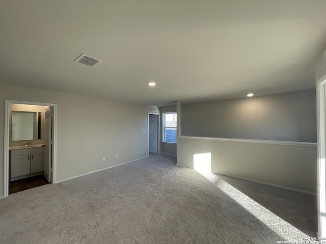 13731 Redtail Lndg, San Antonio, TX 78253 - empty room featuring dark carpet, baseboards, a sink, and recessed lighting