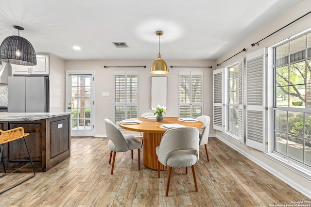 9114 Oak Downs Dr, San Antonio, TX 78230 - dining area with baseboards, light wood-style floors, and recessed lighting