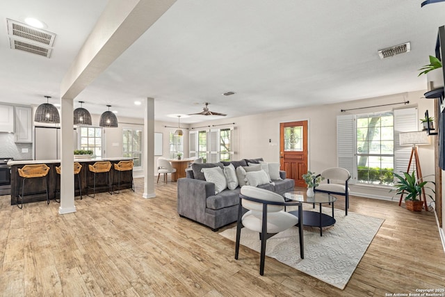 9114 Oak Downs Dr, San Antonio, TX 78230 - living room featuring light wood-style flooring, a ceiling fan, baseboards, and recessed lighting