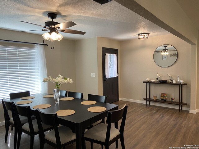 326 Riverview, Mcqueeney, TX 78123 - dining area featuring a ceiling fan, baseboards, dark wood-type flooring, and a textured ceiling