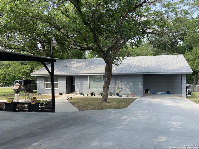 326 Riverview, Mcqueeney, TX 78123 - ranch-style house with brick siding, a shingled roof, and concrete driveway