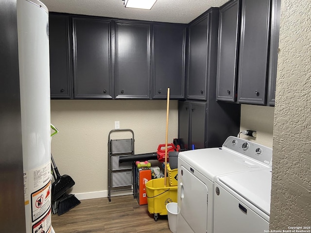 326 Riverview, Mcqueeney, TX 78123 - laundry room with separate washer and dryer, cabinet space, dark wood-style flooring, baseboards, and water heater