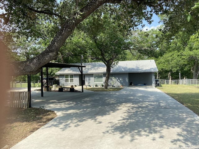 326 Riverview, Mcqueeney, TX 78123 - view of front facade featuring driveway and a carport