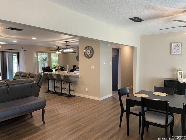 326 Riverview, Mcqueeney, TX 78123 - dining space with ceiling fan, dark wood finished floors, a textured ceiling, baseboards, and recessed lighting