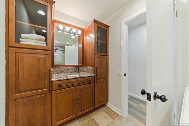 430 Yosemite Dr, San Antonio, TX 78232 - bathroom with vanity, baseboards, and a shower
