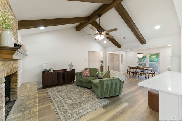 430 Yosemite Dr, San Antonio, TX 78232 - living area with a brick fireplace, beamed ceiling, ceiling fan, light wood-style floors, and high vaulted ceiling