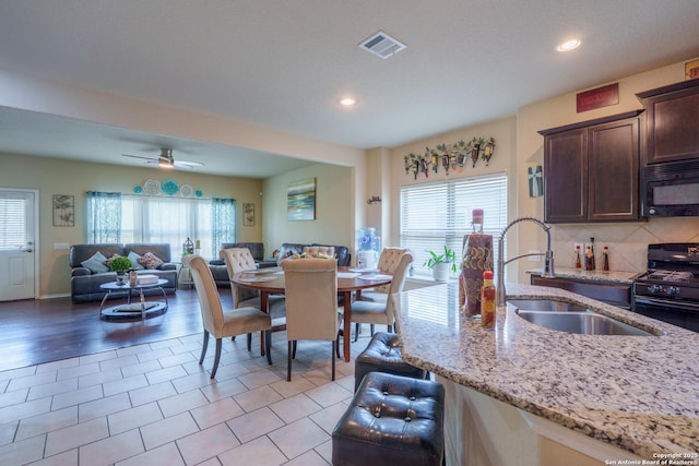 11607 Pelican Pass, San Antonio, TX 78221 - dining room with healthy amount of natural light, recessed lighting, ceiling fan, and light tile patterned floors