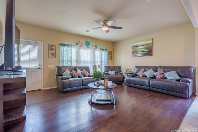 11607 Pelican Pass, San Antonio, TX 78221 - living room with ceiling fan, plenty of natural light, wood-type flooring, a textured ceiling, and baseboards